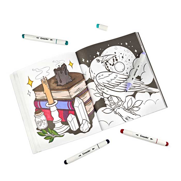 Witchy Woman Adult Coloring Book, 32 Pages. Open book with partially colored page surrounded by crayola alcohol markers.
