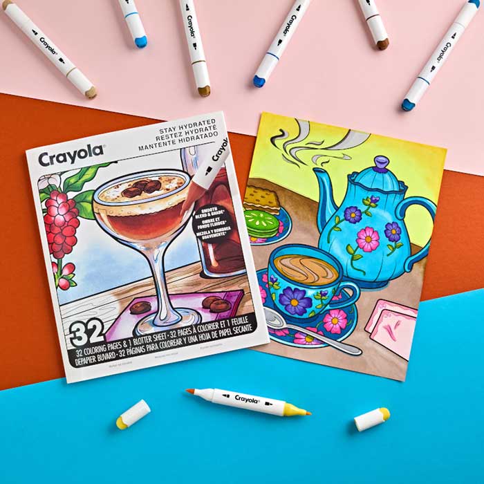 Stay Hydrated Adult Coloring Book, 32 Pgs. Book and colored page surrounded by alcohol markers.